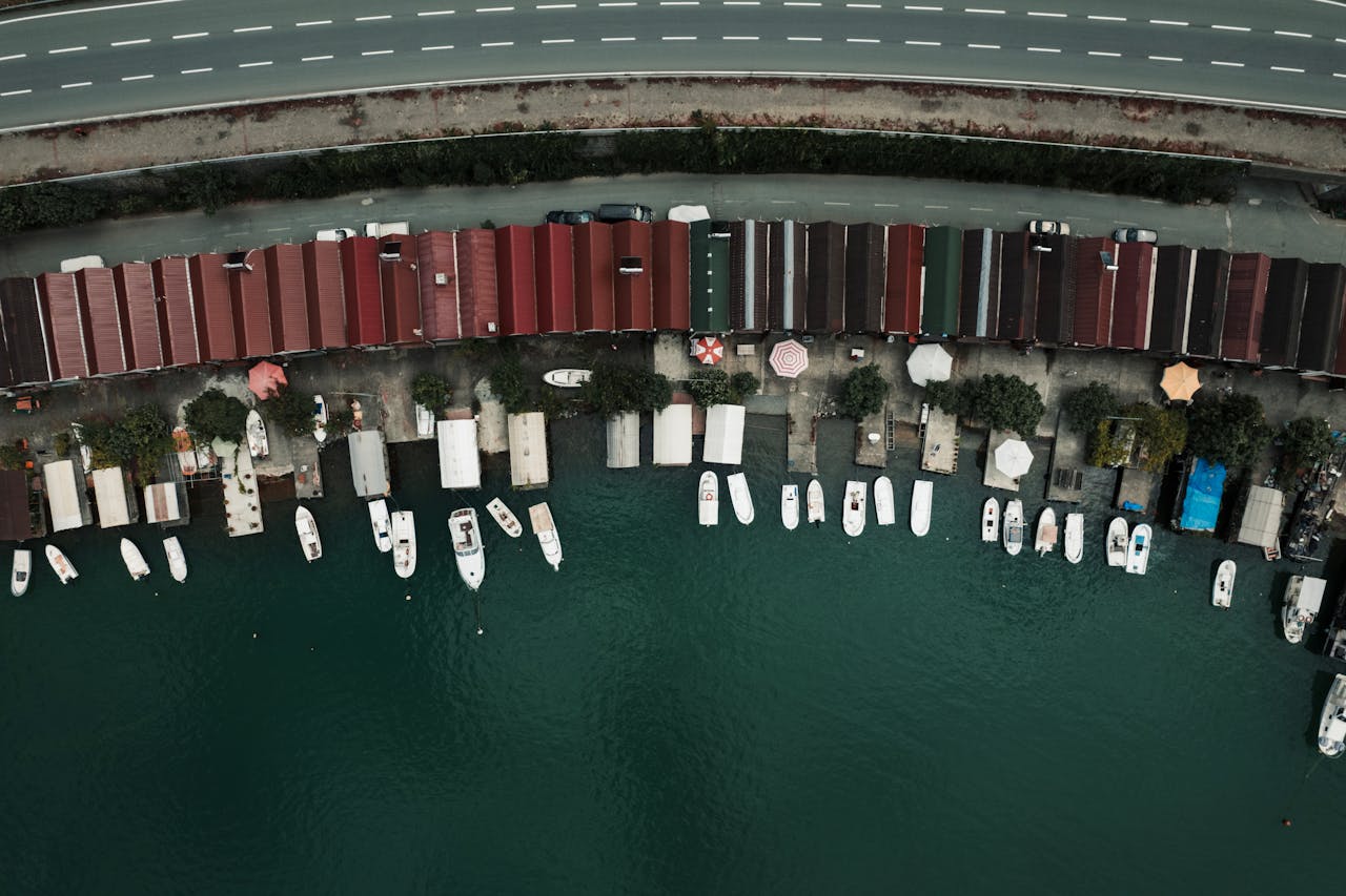Aerial view of boats docked at the marina in Artvin, Türkiye, showcasing a vibrant coastal scene.